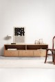 Modern TV unit in natural oak color - sturdy construction and aesthetic appearance.